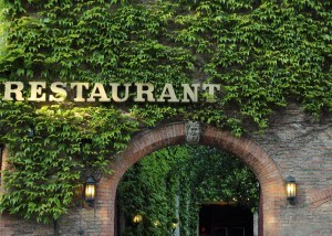 Restaurant patrons settling tabs with mobile payments